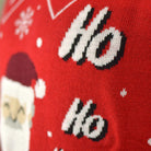 Couple's Ugly Christmas Sweater with Santa Coming through the Chimney detail